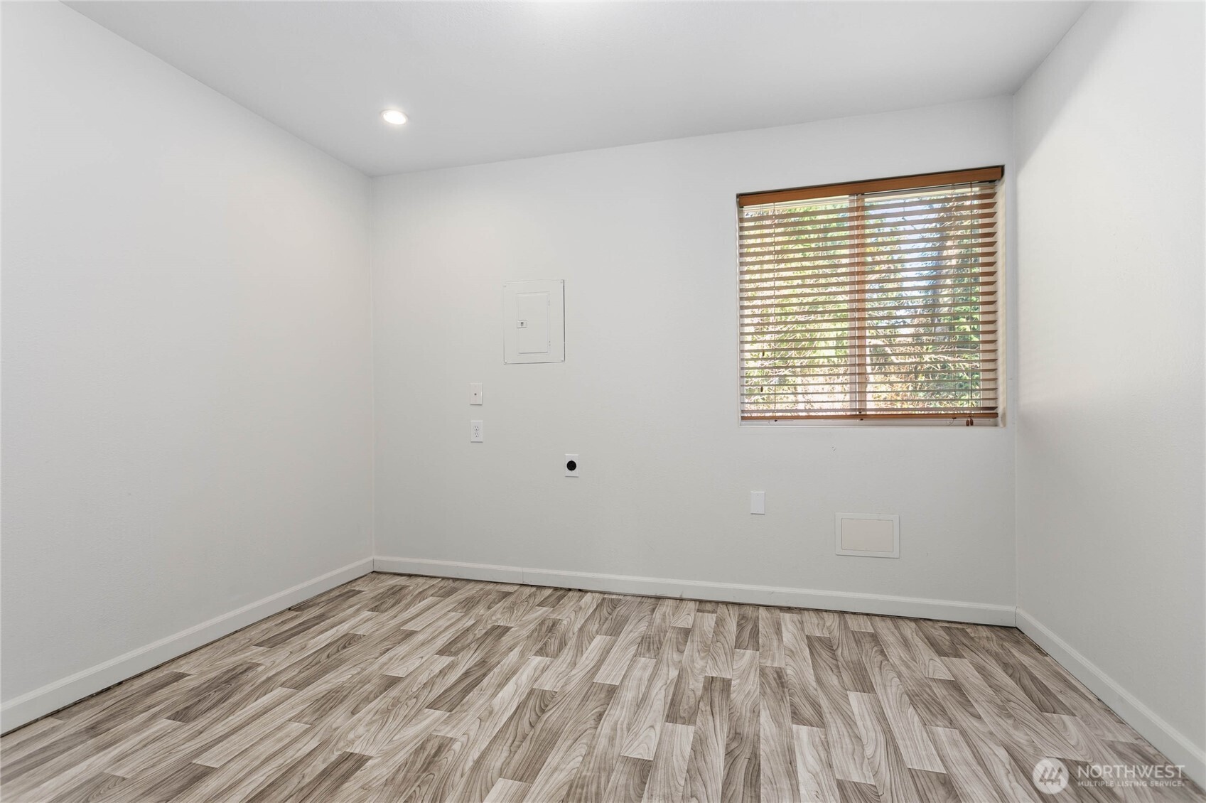 3269 Haynie Road Custer, WA 98240 - Photo 35 of 39 a view of an empty room with wooden floor and a window
