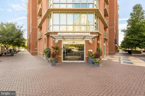 a view of a brick house with many windows
