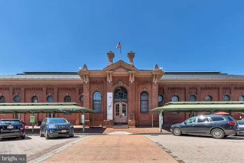 a front view of a building with parking space