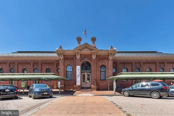 a front view of a building with parking space
