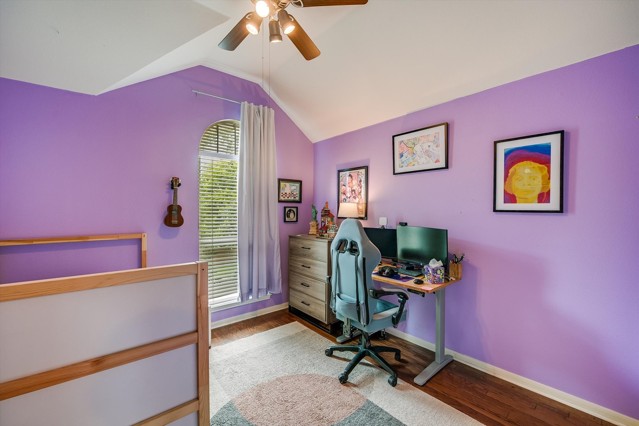 6456 Ruxton Lane Austin, TX 78749 - Photo 22 of 30 Hardwood flooring and vaulted ceilings frame this inviting bedroom with a sun-filled window.