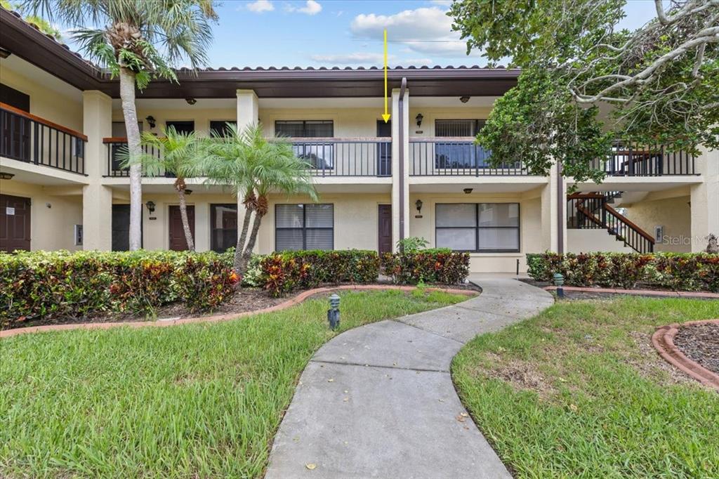 412 Hammock Pine Boulevard, Unit 412 Clearwater, FL 33761 - Photo 1 of 1 front view of a house with a yard