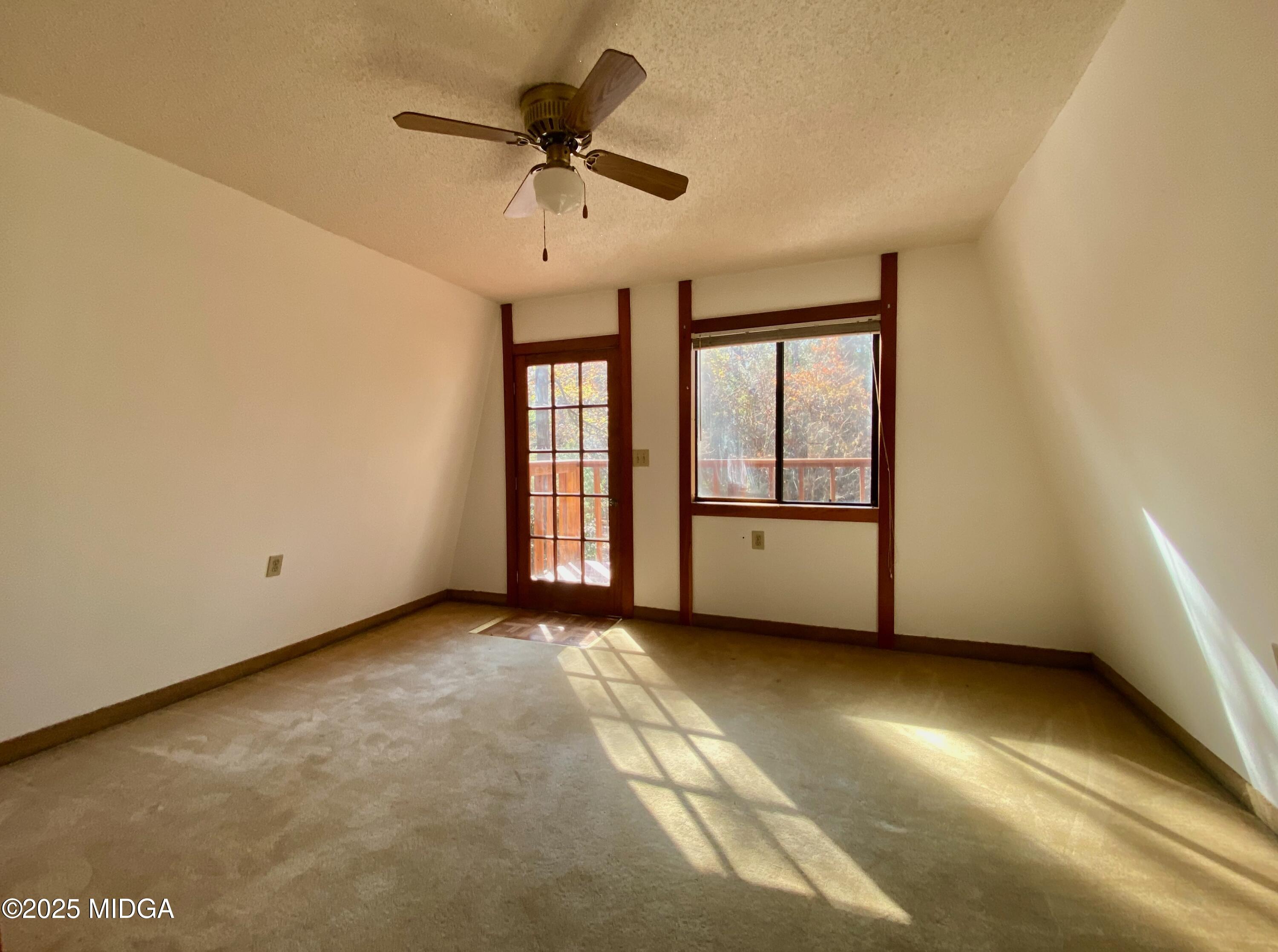 231 West Seminole Drive Byron, GA 31008 - Photo 14 of 38 a view of an empty room with a window