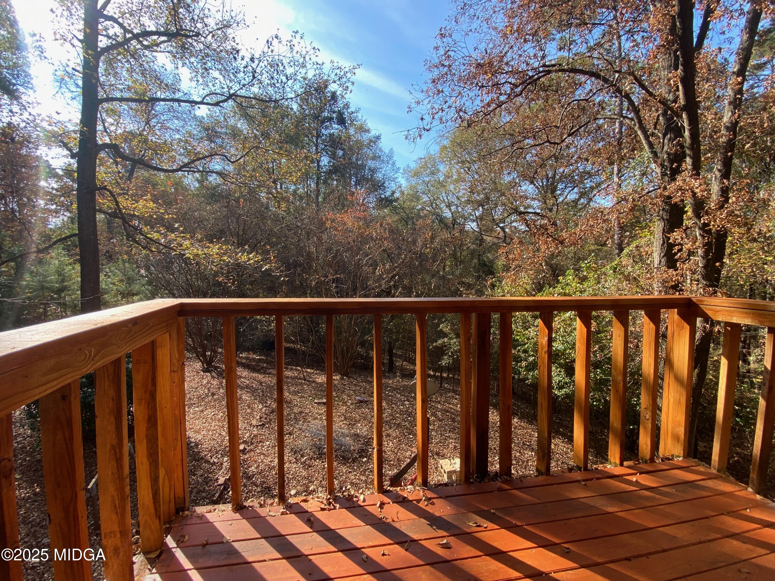 231 West Seminole Drive Byron, GA 31008 - Photo 15 of 38 a view of a balcony with wooden floor and fence