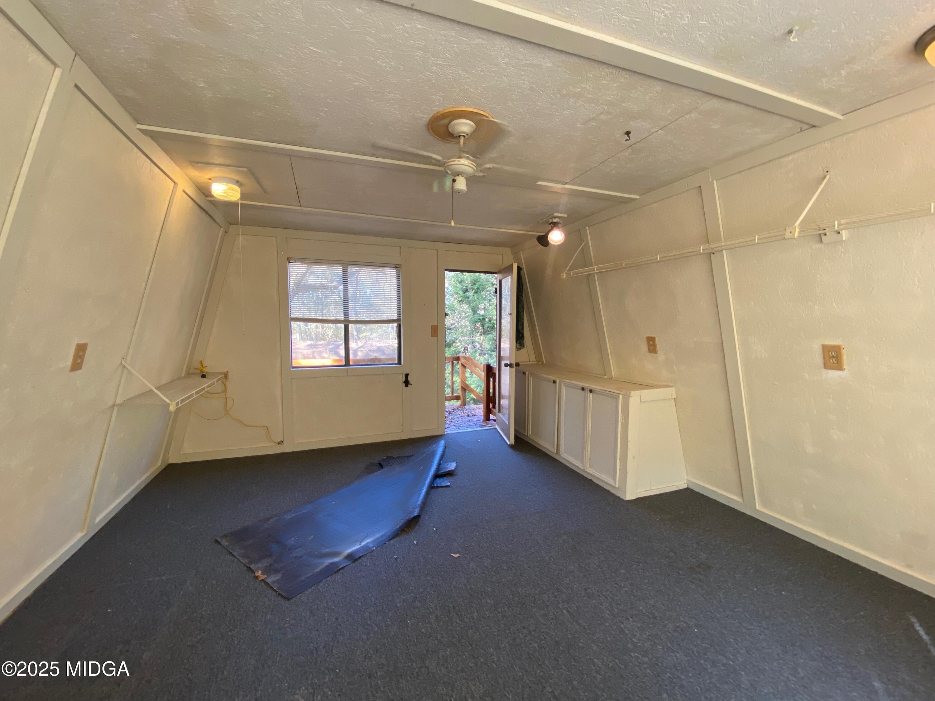 231 West Seminole Drive Byron, GA 31008 - Photo 25 of 38 a view of a livingroom with an empty space and windows