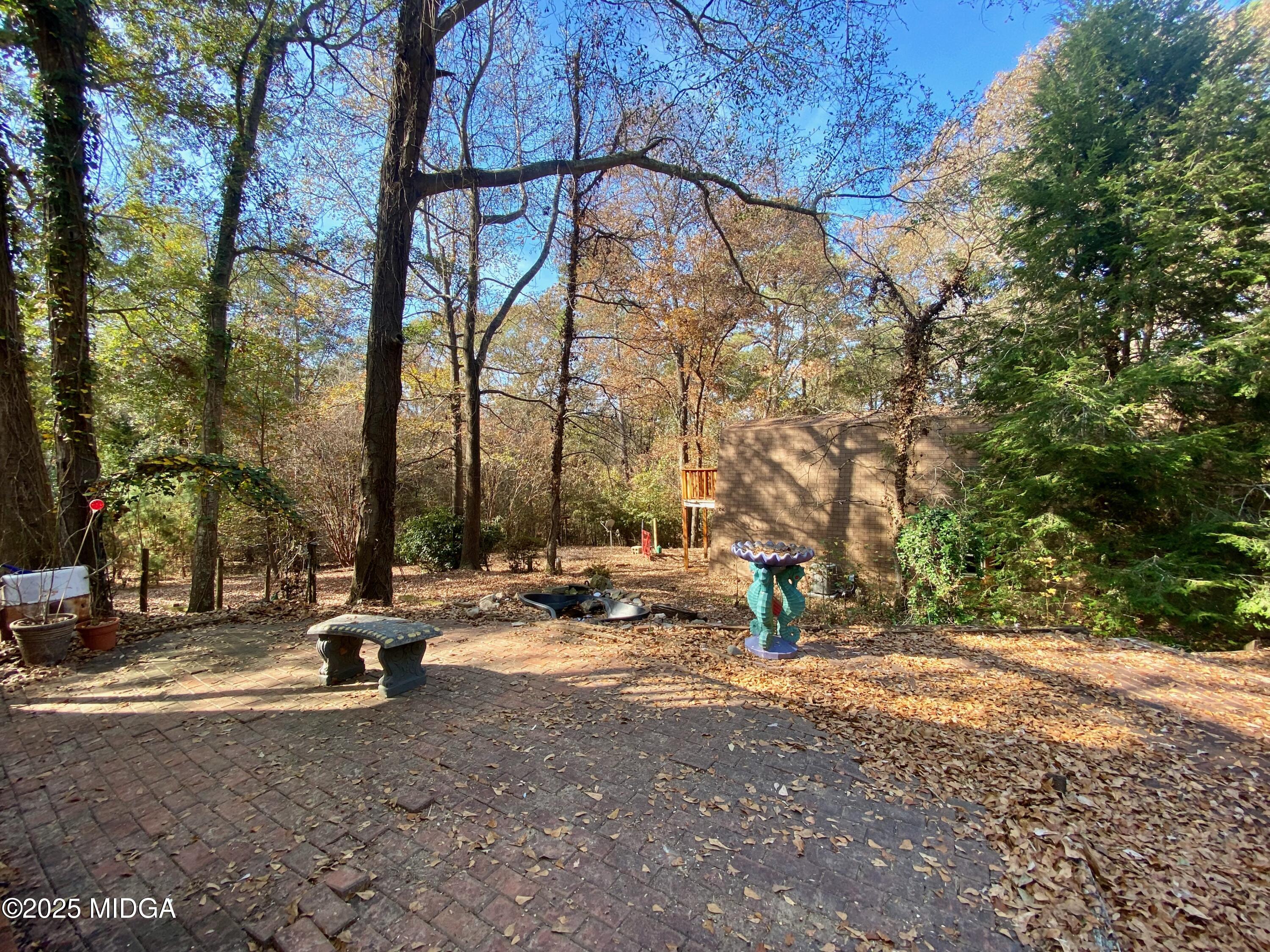 231 West Seminole Drive Byron, GA 31008 - Photo 30 of 38 a ground with lots of tall trees
