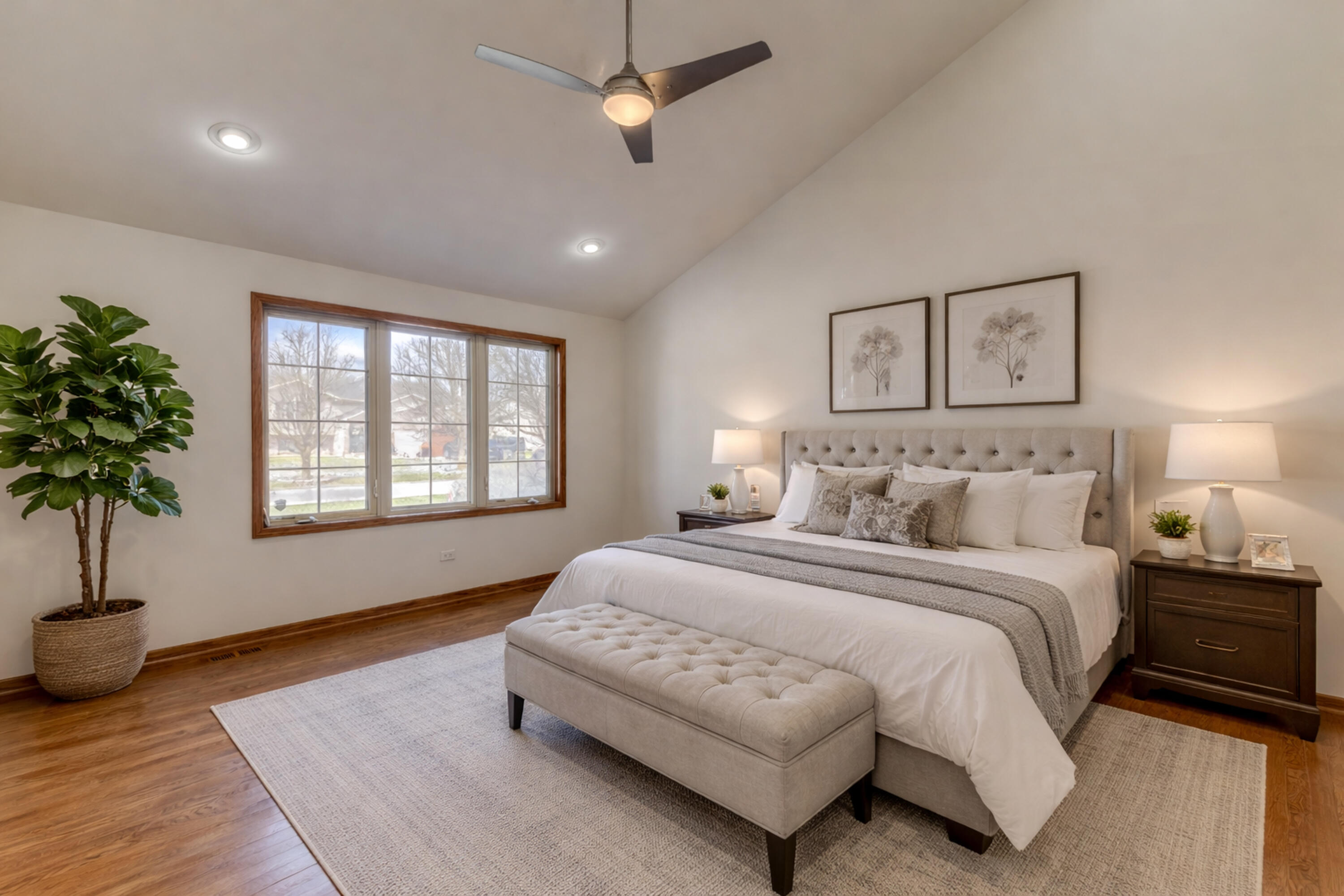 9575 Calumet Street Dyer, IN 46311 - Photo 11 of 53 a spacious bedroom with a large bed and a potted plant