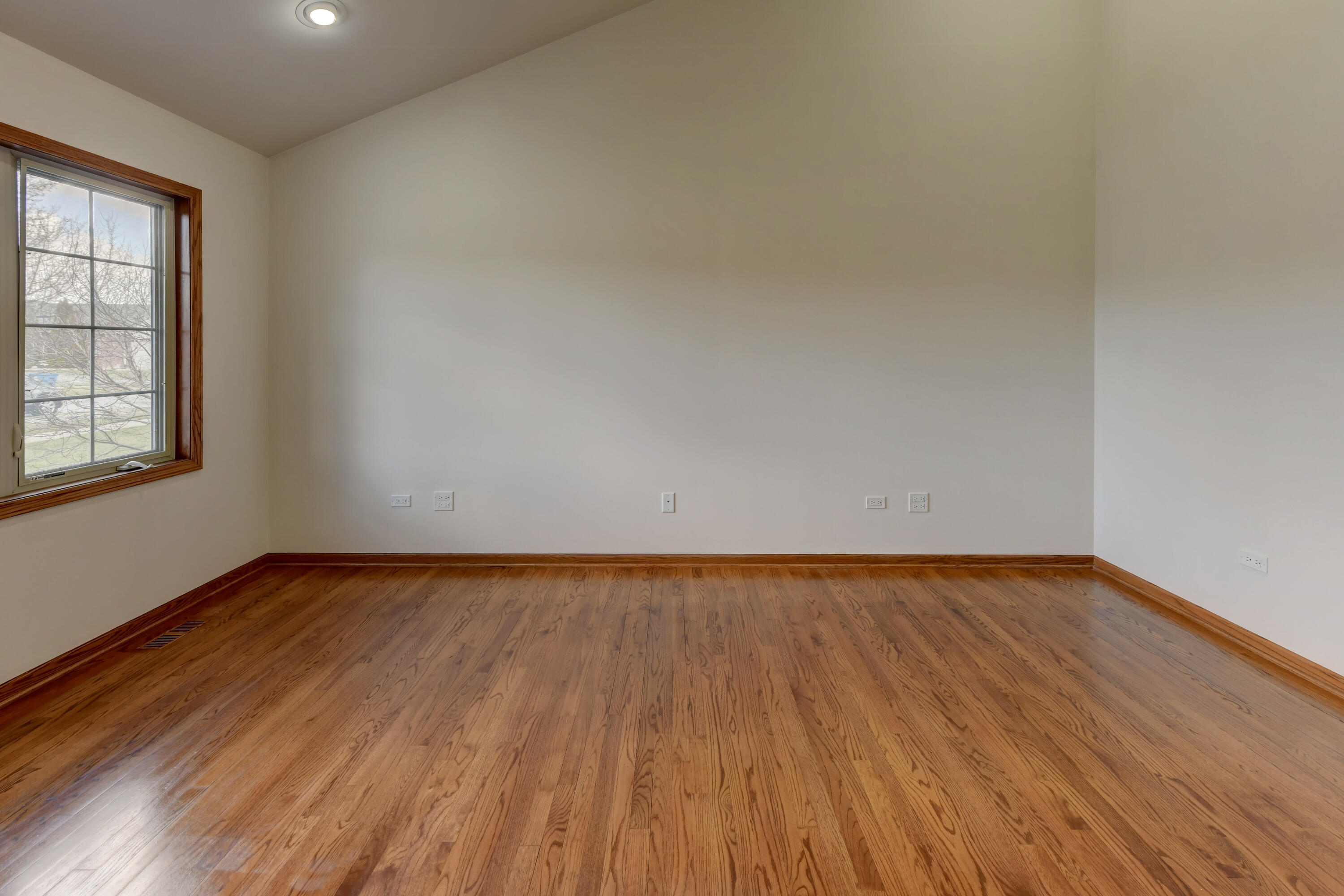 9575 Calumet Street Dyer, IN 46311 - Photo 12 of 53 an empty room with wooden floor and windows