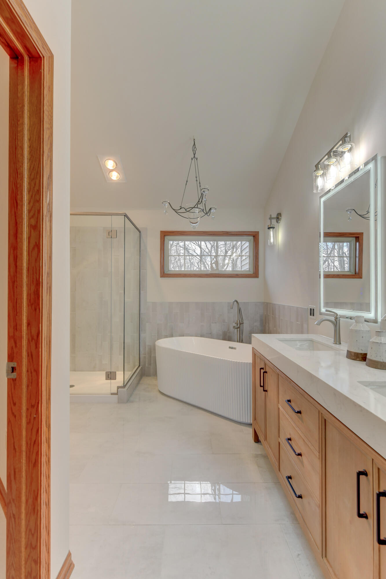 9575 Calumet Street Dyer, IN 46311 - Photo 14 of 53 a spacious bathroom with a double vanity sink and a mirror