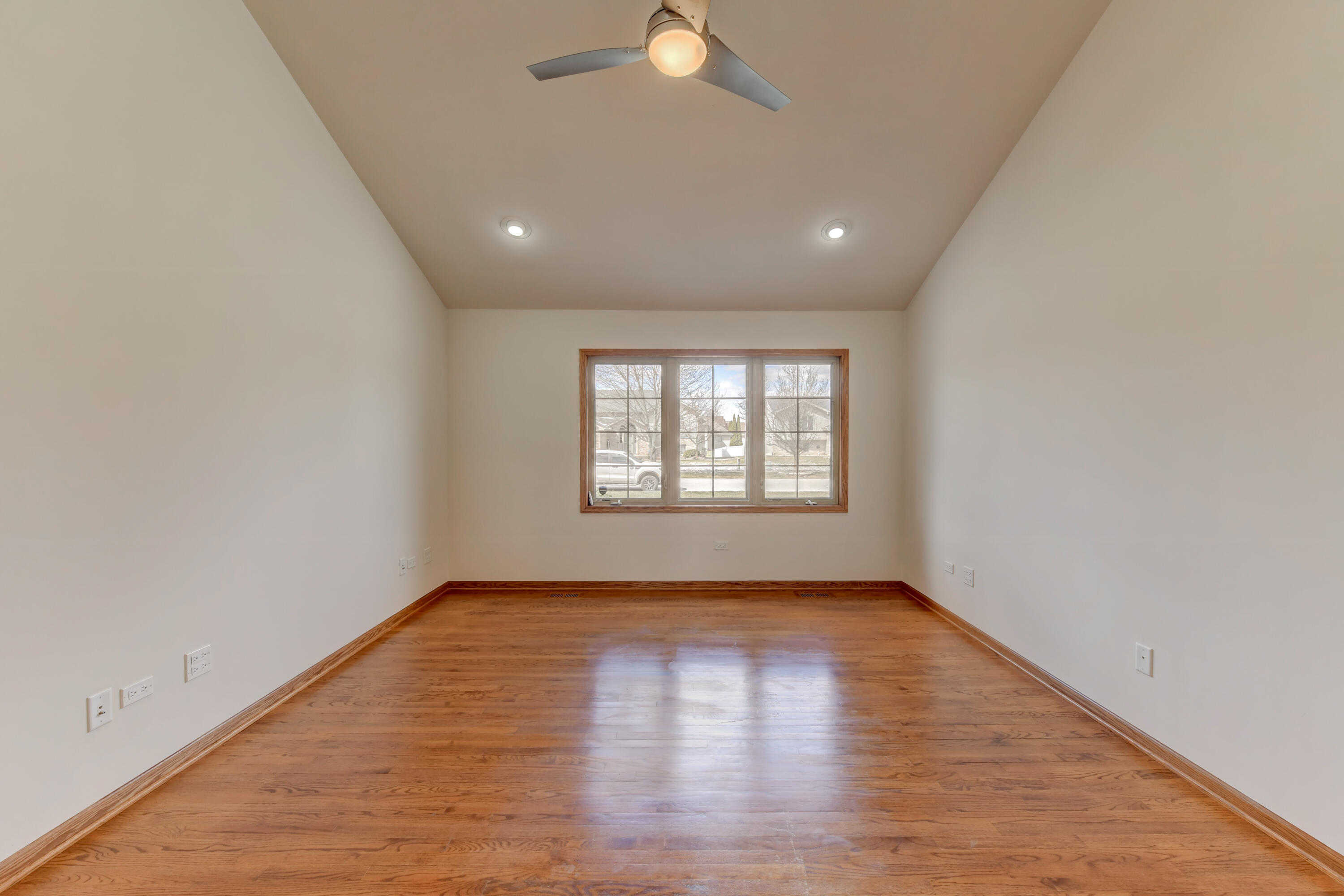 9575 Calumet Street Dyer, IN 46311 - Photo 19 of 53 an empty room with wooden floor and windows