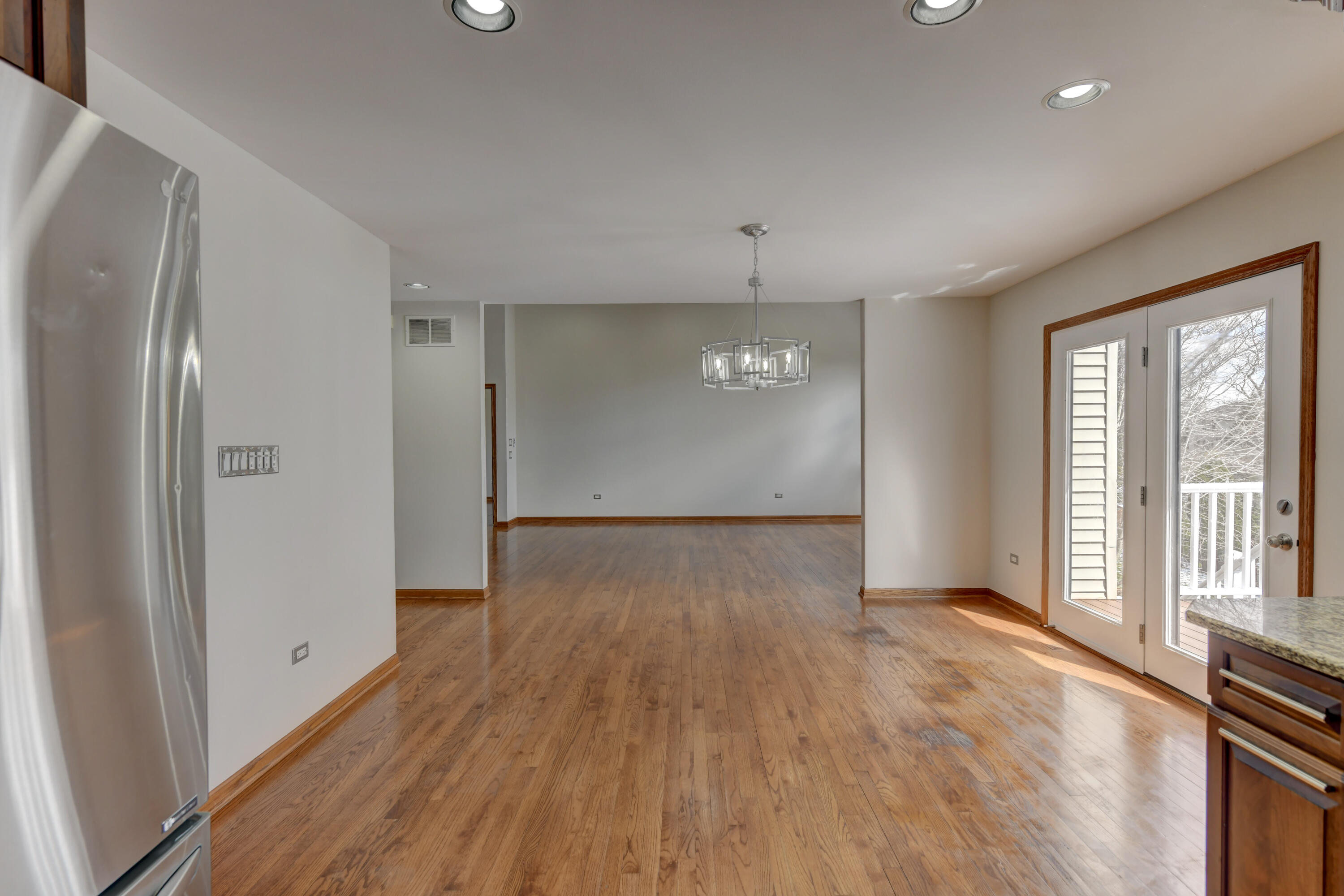 9575 Calumet Street Dyer, IN 46311 - Photo 33 of 53 a view of an empty room with wooden floor and a window