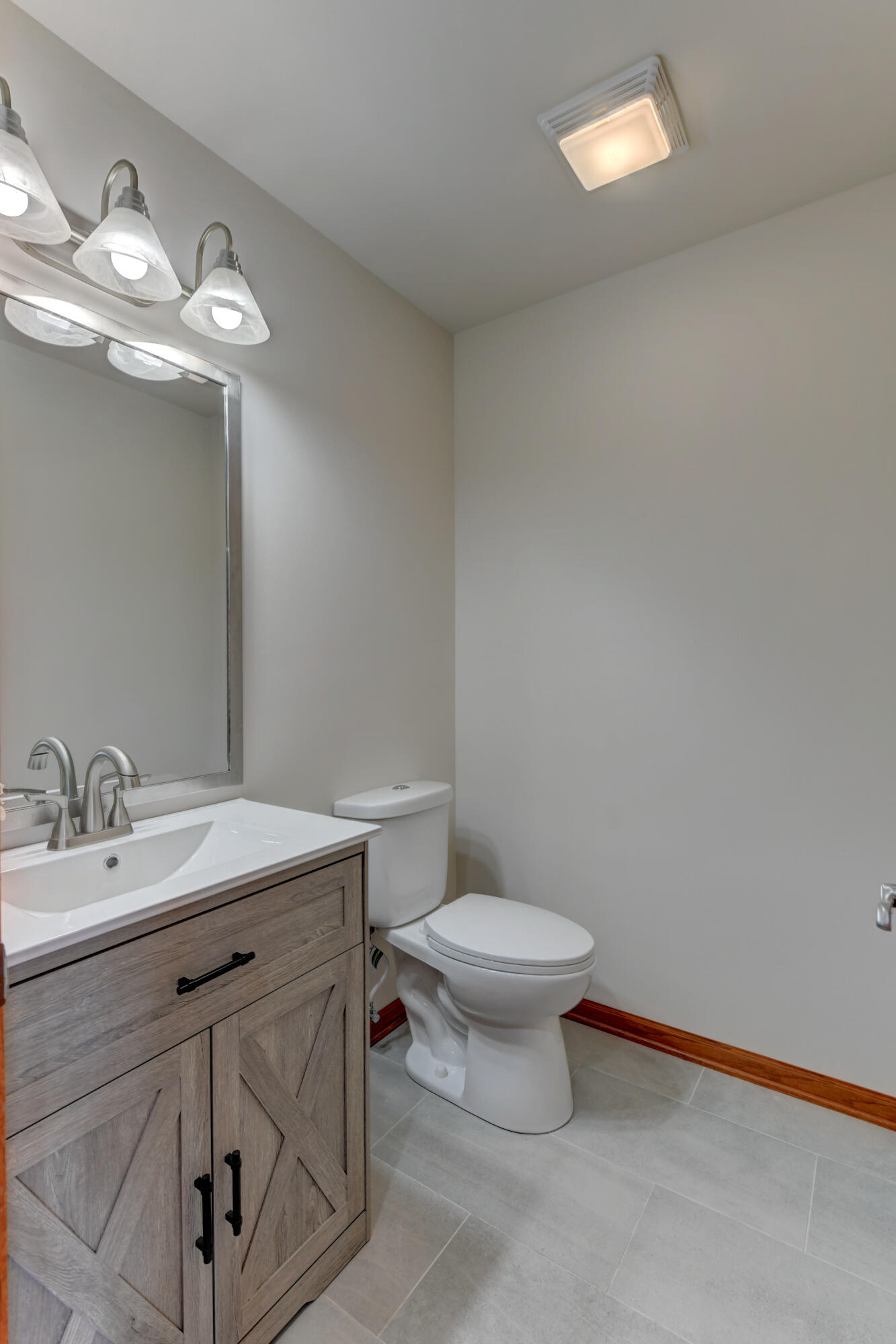 9575 Calumet Street Dyer, IN 46311 - Photo 9 of 53 a bathroom with a sink a toilet and a mirror