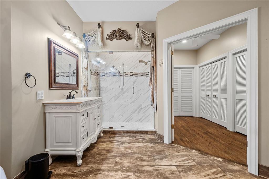 1351 Lindsey Road New Castle, PA 16105 - Photo 14 of 49 a bathroom with a sink a mirror and a shower