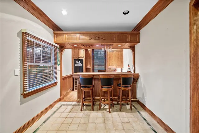 a view of a dining room with furniture and window