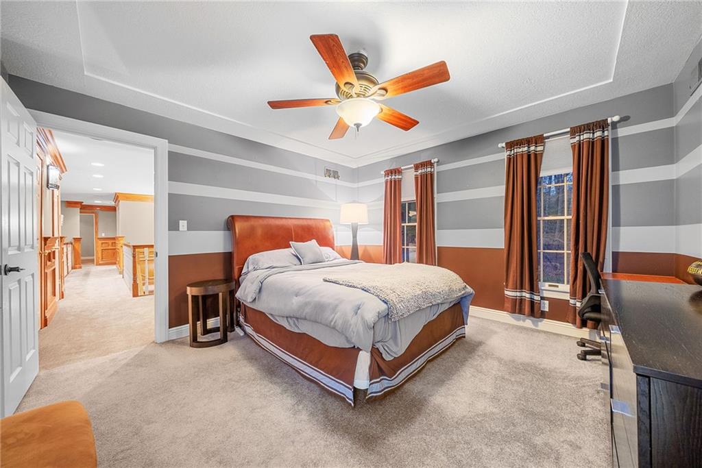 1351 Lindsey Road New Castle, PA 16105 - Photo 23 of 49 a bedroom with a large bed and a chandelier