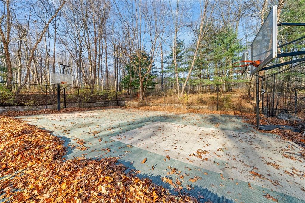 1351 Lindsey Road New Castle, PA 16105 - Photo 43 of 49 a backyard of a house with large trees and covered with wooden fence