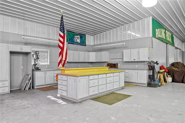 a view of a kitchen with a sink and cabinets