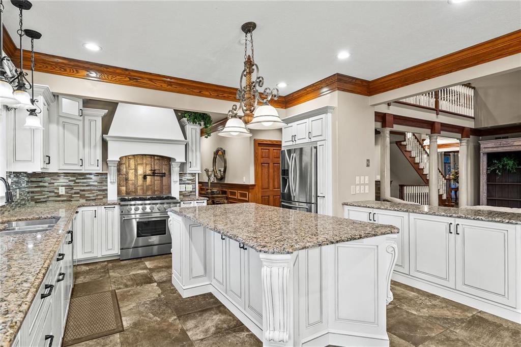 1351 Lindsey Road New Castle, PA 16105 - Photo 6 of 49 a kitchen with stainless steel appliances granite countertop a sink stove and refrigerator