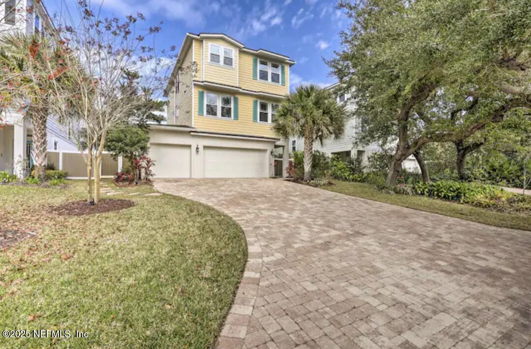168 Lawn Avenue St. Augustine, FL 32084 - Photo 1 of 36 a front view of a house with a yard