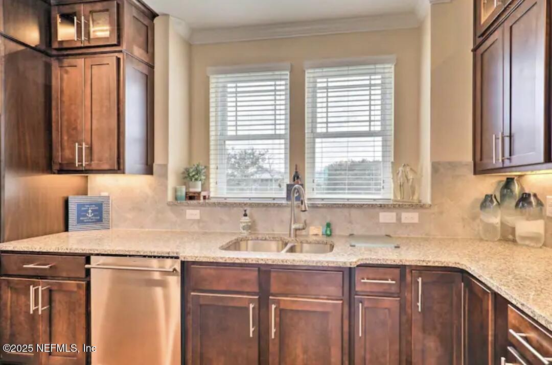 168 Lawn Avenue St. Augustine, FL 32084 - Photo 14 of 36 a kitchen with stainless steel appliances granite countertop a sink and a window