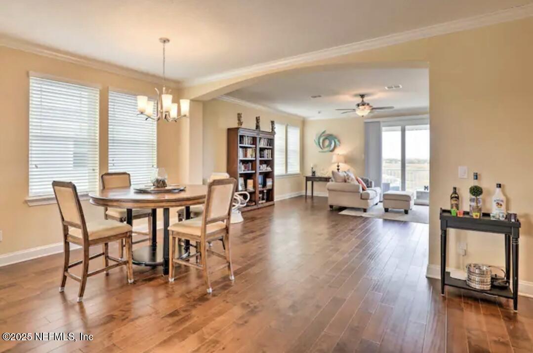 168 Lawn Avenue St. Augustine, FL 32084 - Photo 16 of 36 a living room with furniture and a wooden floor