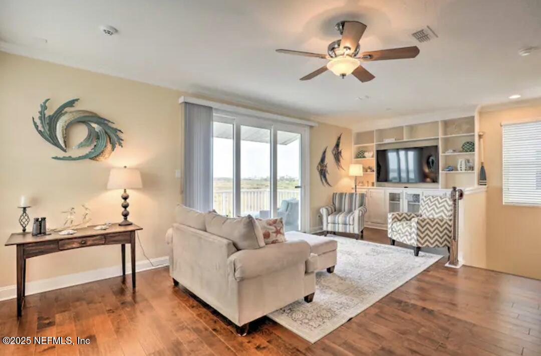 168 Lawn Avenue St. Augustine, FL 32084 - Photo 9 of 36 a living room with furniture and a large window