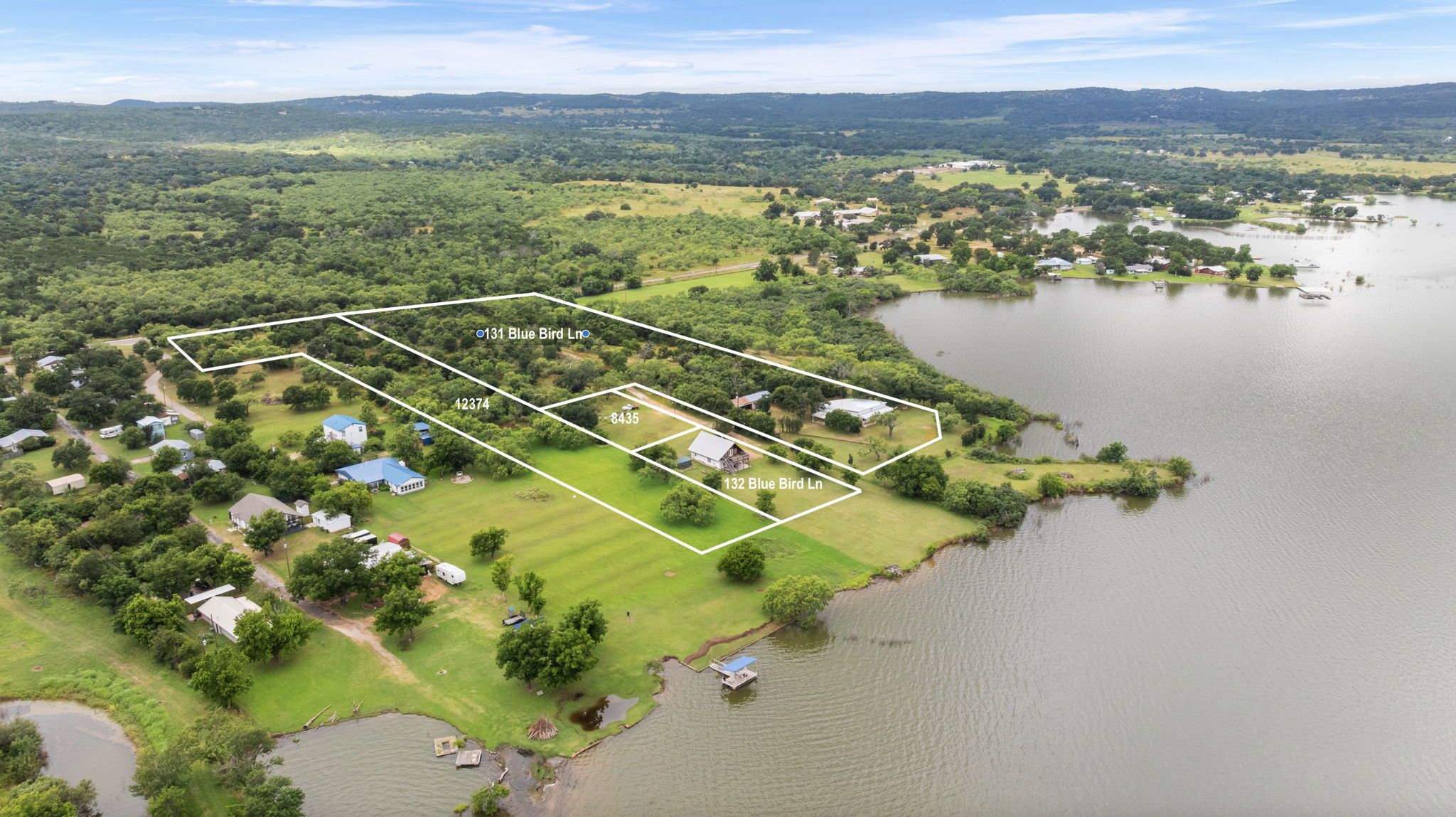 0 Ranch Road 2241 Road Tow, TX 78672 - Photo 10 of 10 Discover expansive lakefront acreage with lush trees and a serene natural setting.
