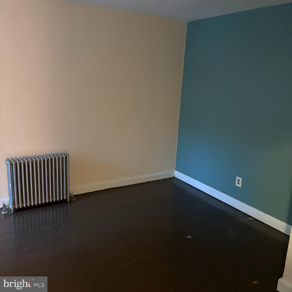 373 East Butler Avenue, Unit A Ambler, PA 19002 - Photo 10 of 14 an empty room with wooden floor and windows