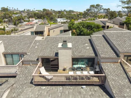 an aerial view of a house with a balcony