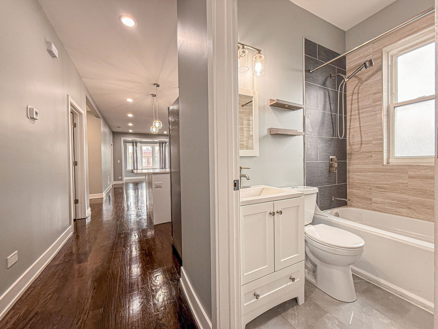 4817 West Jackson Boulevard, Unit 2 Chicago, IL 60644 - Photo 12 of 20 a bathroom with a sink toilet and shower