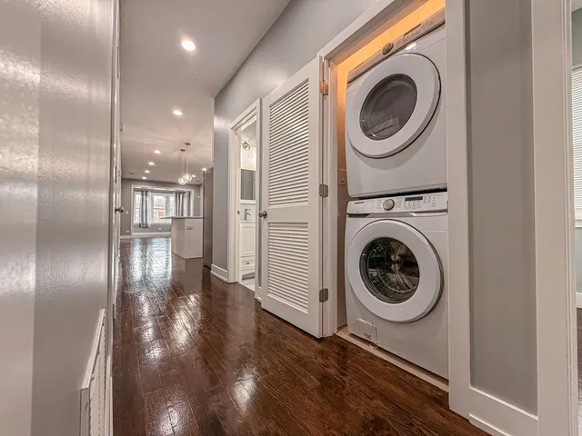 a view of a hallway with washer and dryer