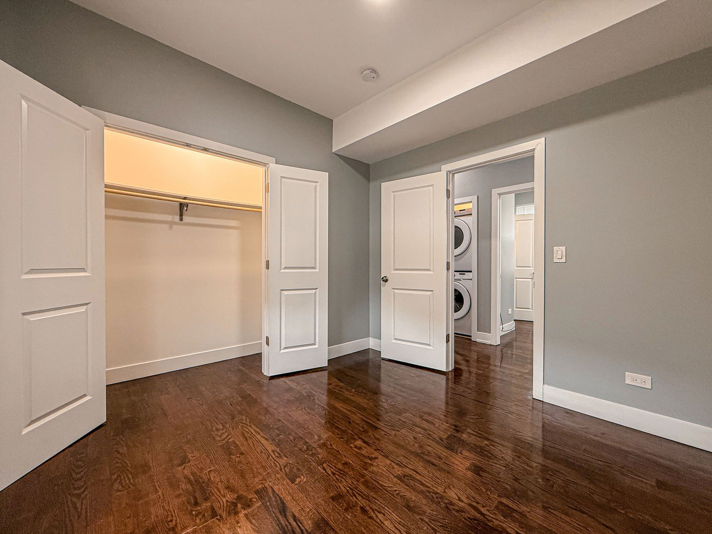4817 West Jackson Boulevard, Unit 2 Chicago, IL 60644 - Photo 14 of 20 a view of empty room with wooden floor and window