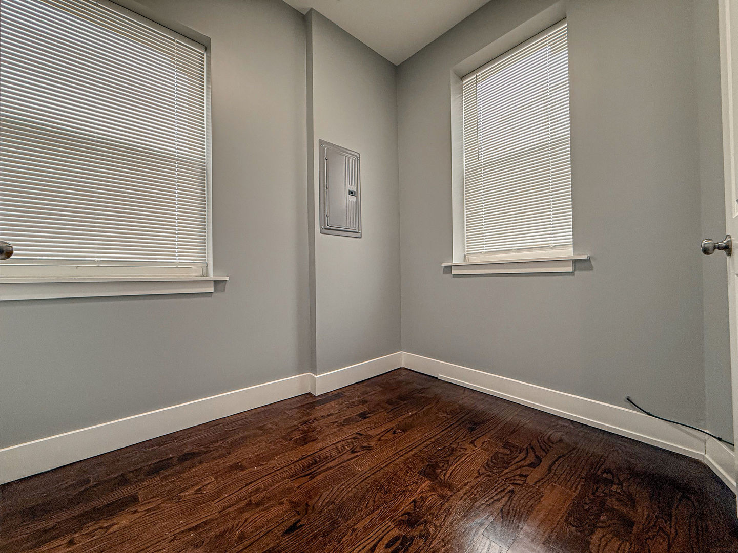 4817 West Jackson Boulevard, Unit 2 Chicago, IL 60644 - Photo 15 of 20 a view of an empty room with wooden floor and a window