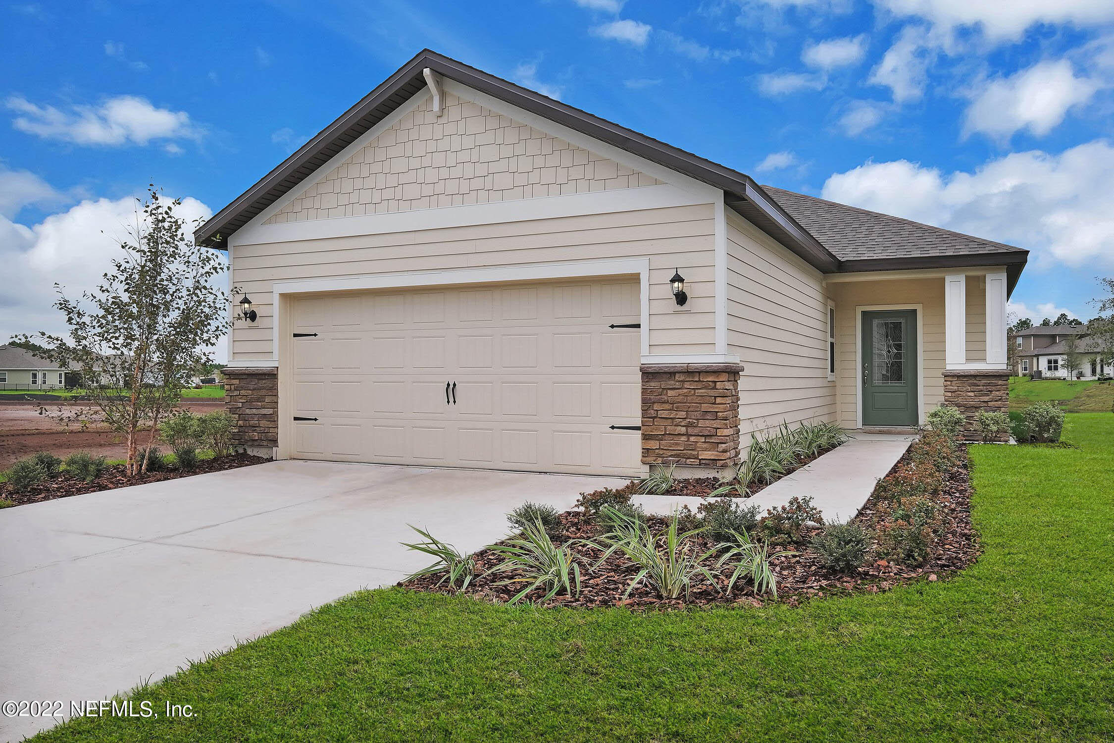 a front view of house with yard and green space