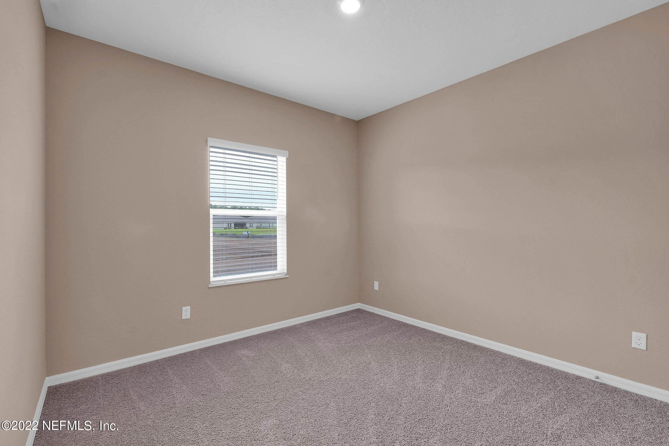 52 Falcon Ridge Road St. Augustine, FL 32084 - Photo 11 of 12 an empty room with a window
