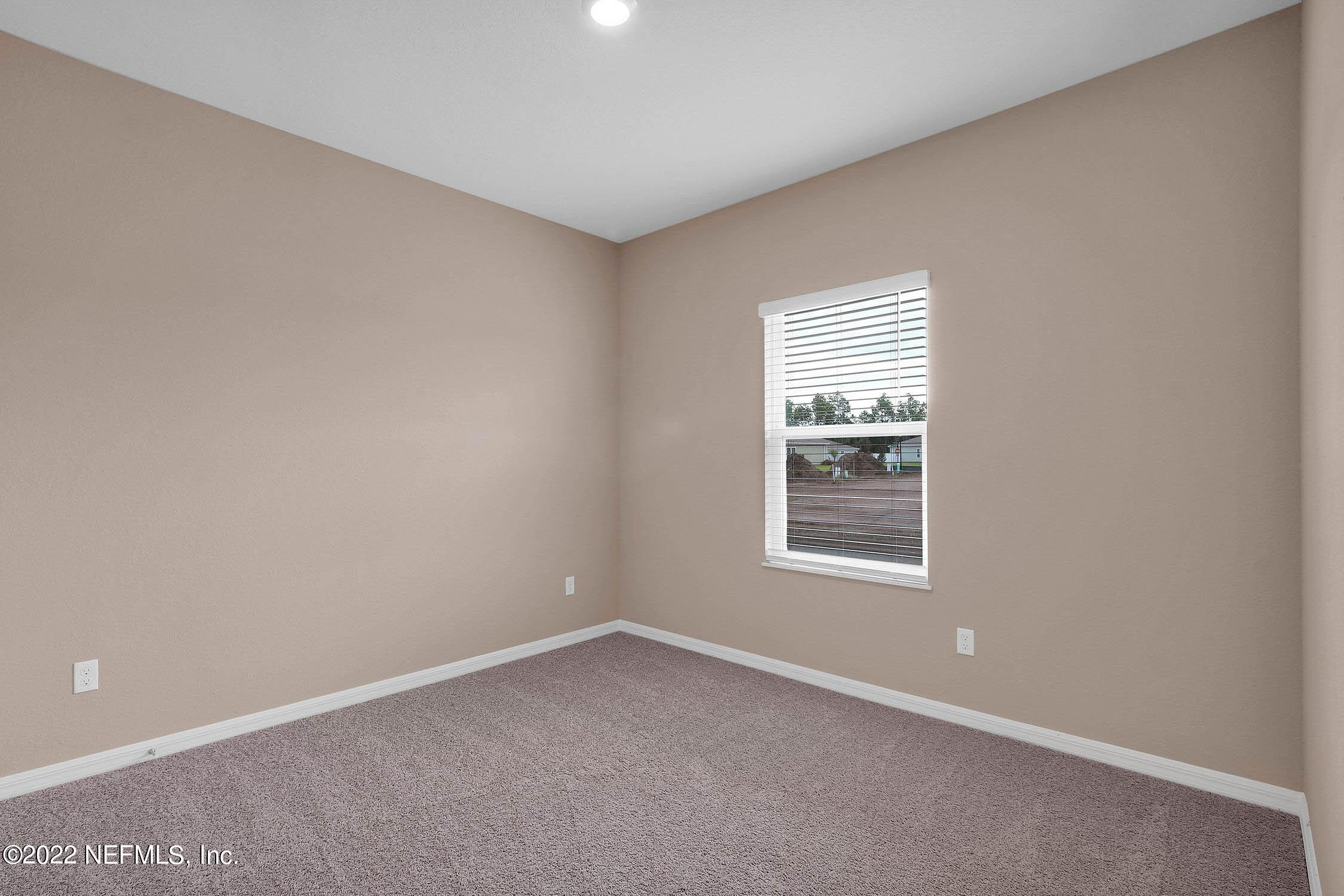 52 Falcon Ridge Road St. Augustine, FL 32084 - Photo 9 of 12 an empty room with a window