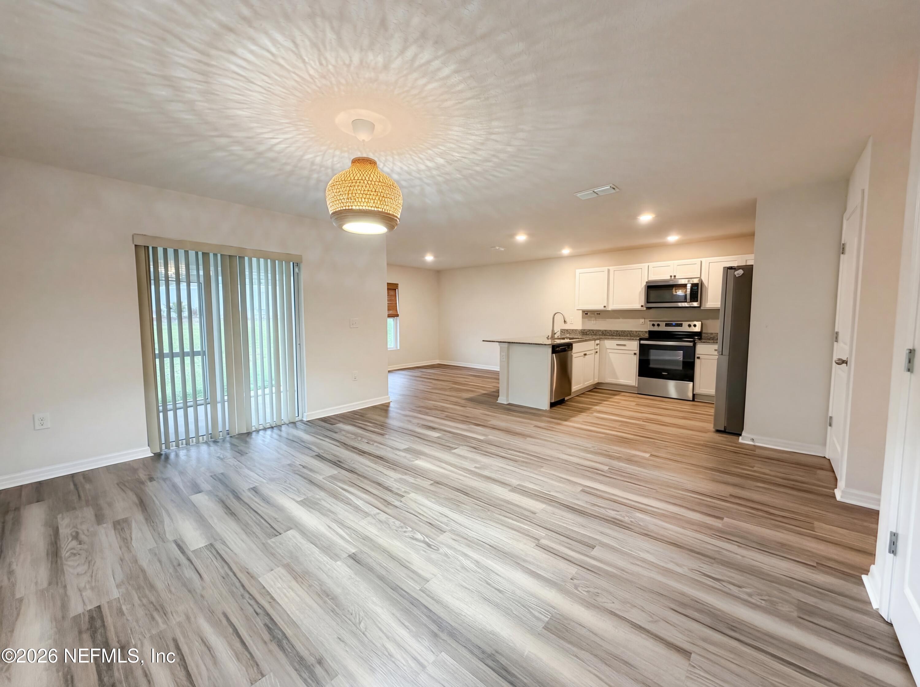 171 River Ridge Welaka, FL 32193 - Photo 3 of 17 a view of empty room with wooden floor and window