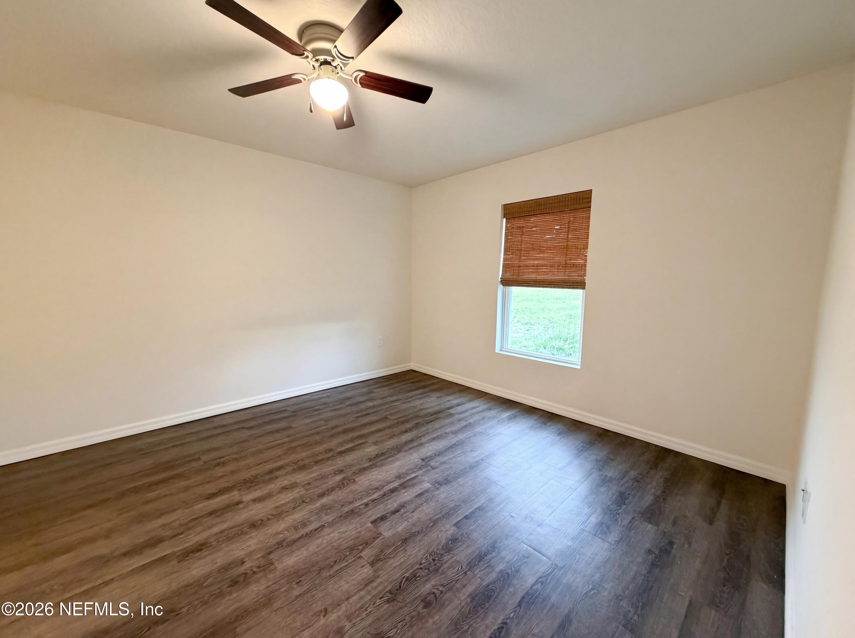 171 River Ridge Welaka, FL 32193 - Photo 4 of 17 a view of an empty room with wooden floor and a window