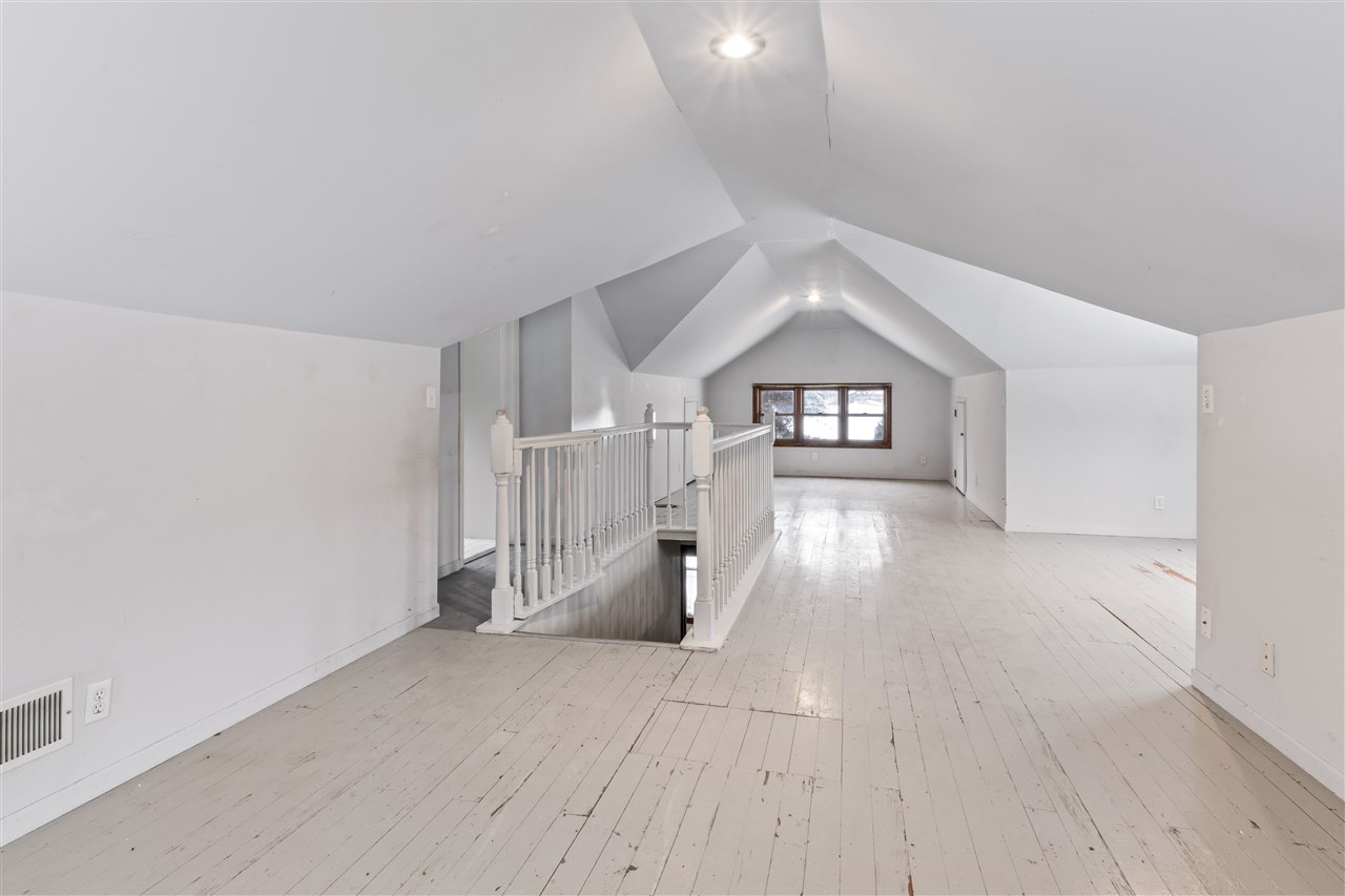 3202 Prairie Road Rockford, IL 61102 - Photo 13 of 21 wooden floor in an empty room with a window