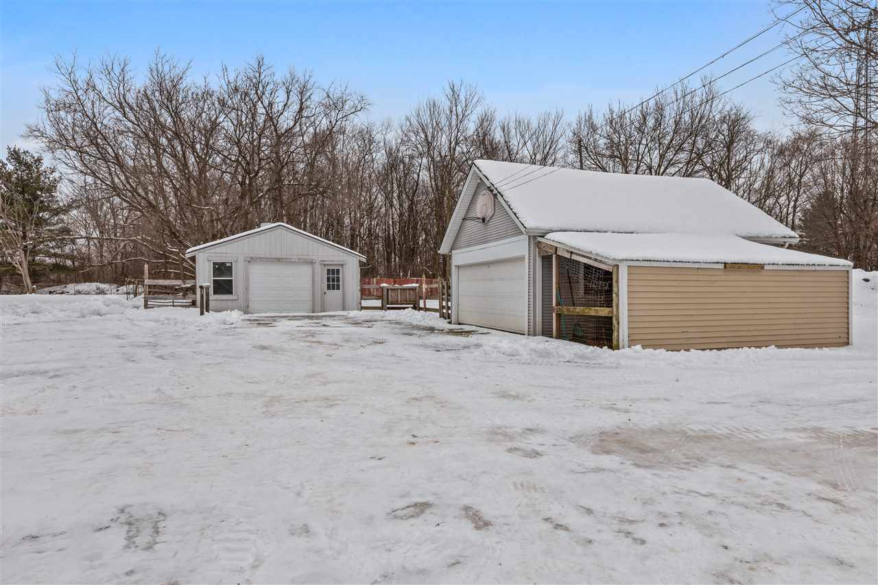 3202 Prairie Road Rockford, IL 61102 - Photo 21 of 21 a front view of a house with a yard and garage