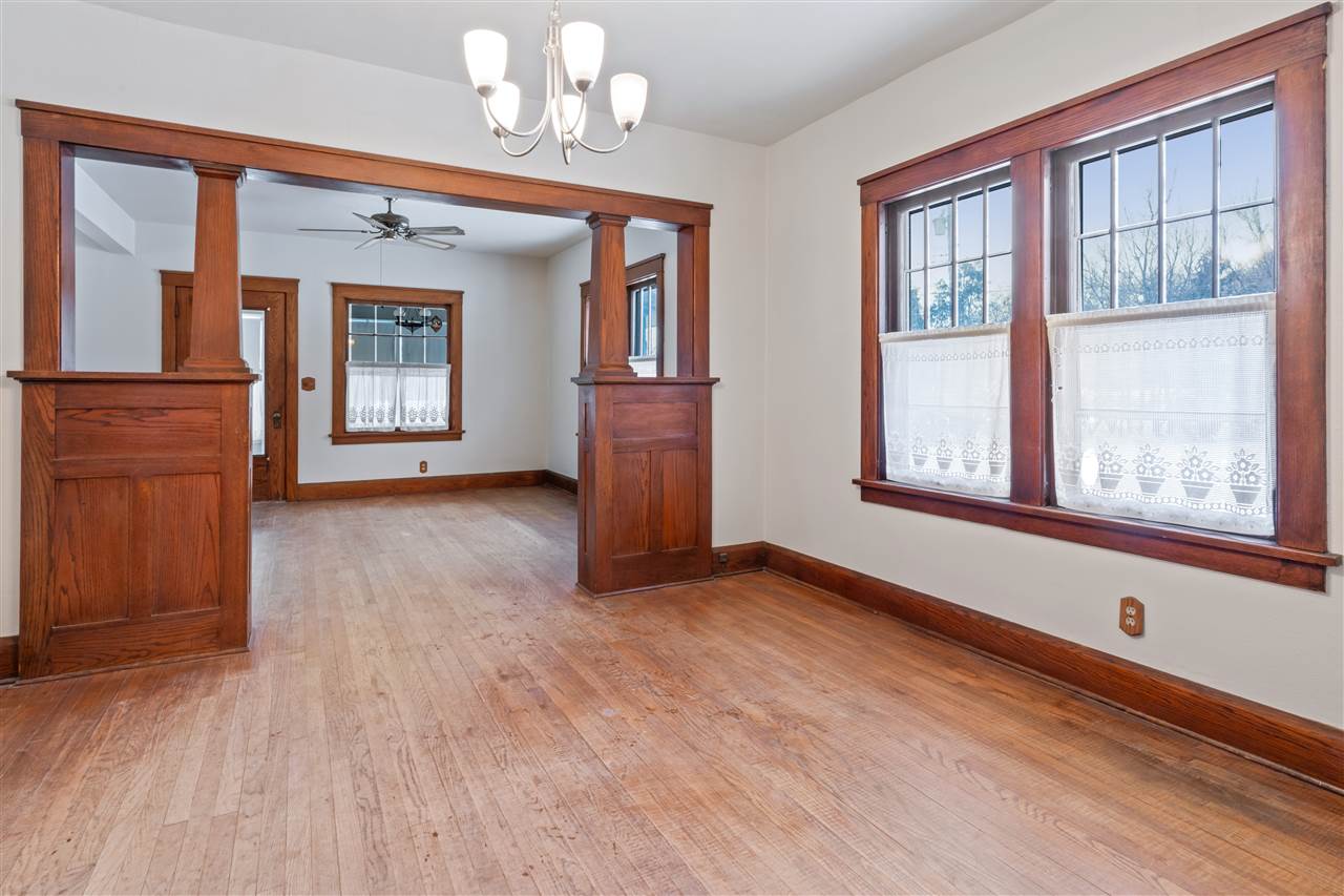 3202 Prairie Road Rockford, IL 61102 - Photo 6 of 21 a view of an empty room with a window and wooden floor