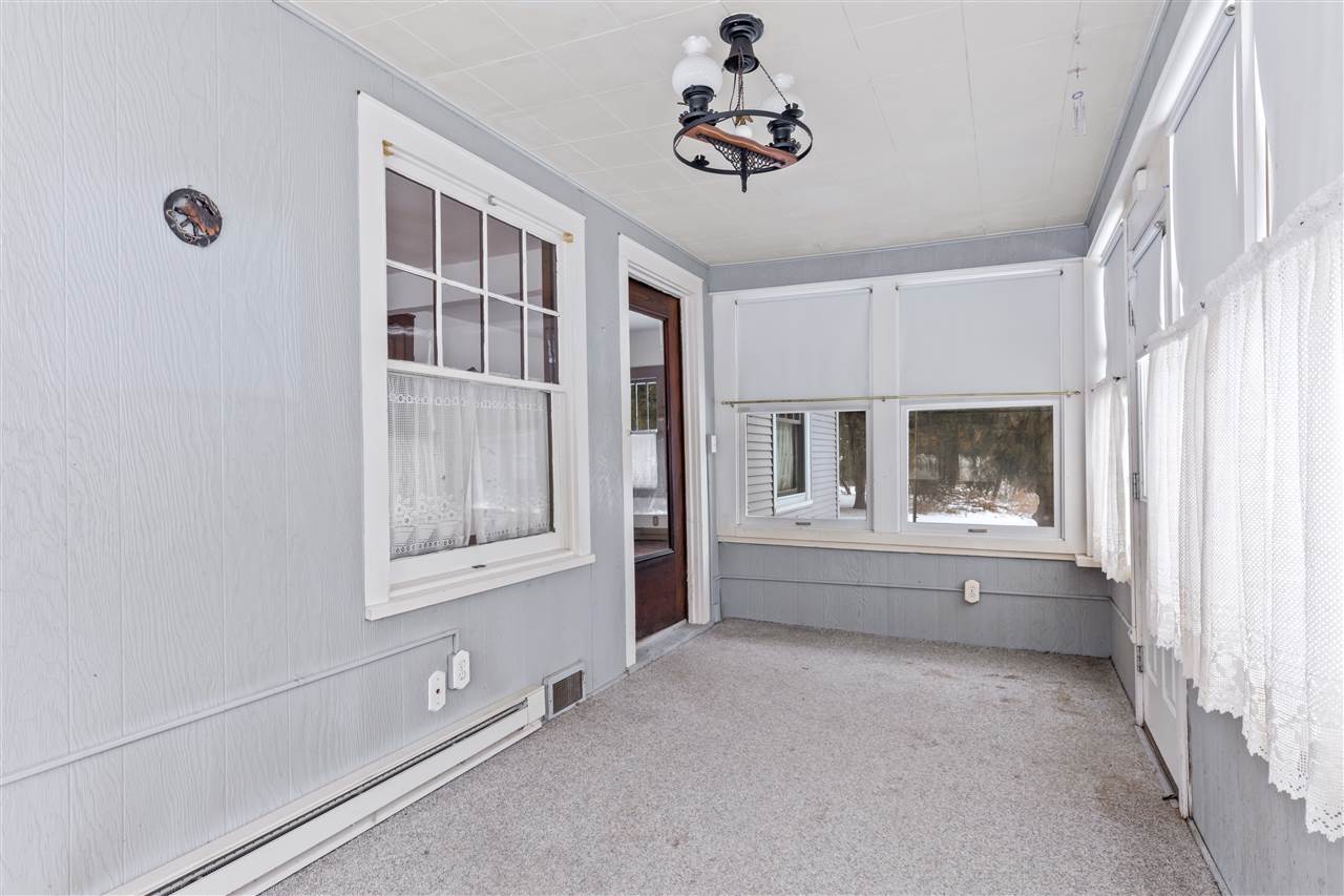 3202 Prairie Road Rockford, IL 61102 - Photo 7 of 21 a view of an empty room with a window and fireplace