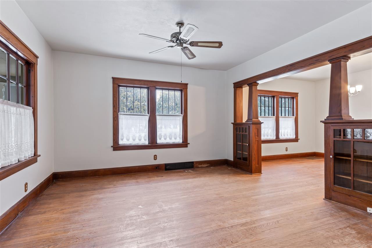 3202 Prairie Road Rockford, IL 61102 - Photo 8 of 21 an empty room with windows and ceiling fan