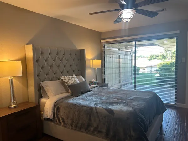 a bedroom with a large bed and a window