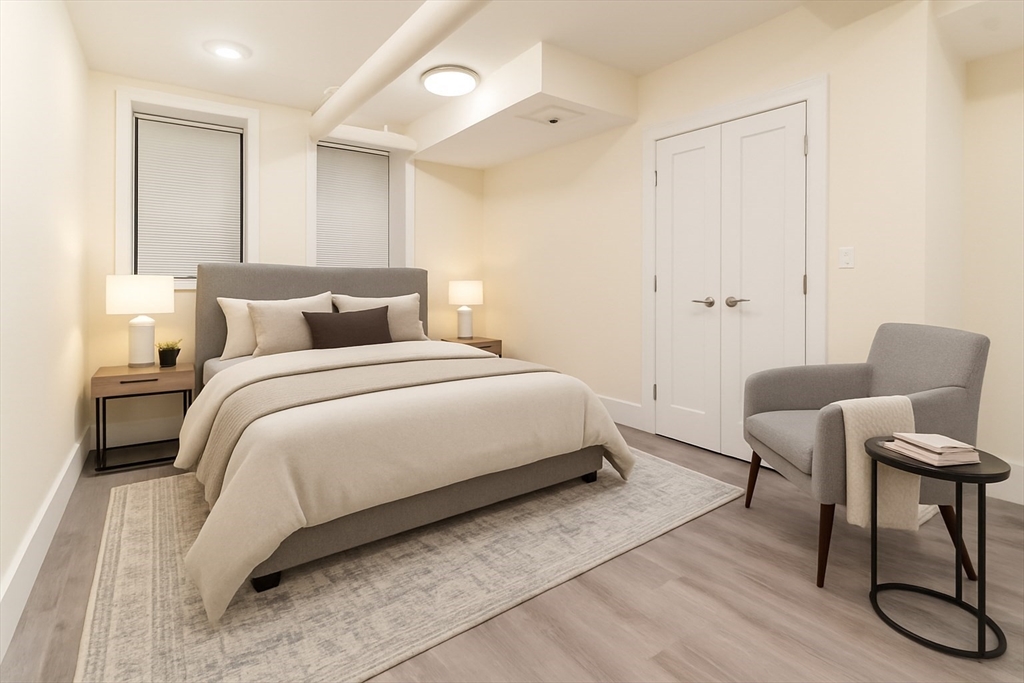 a bedroom with a bed and a chair