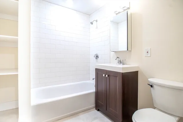 a bathroom with a sink toilet and bathtub