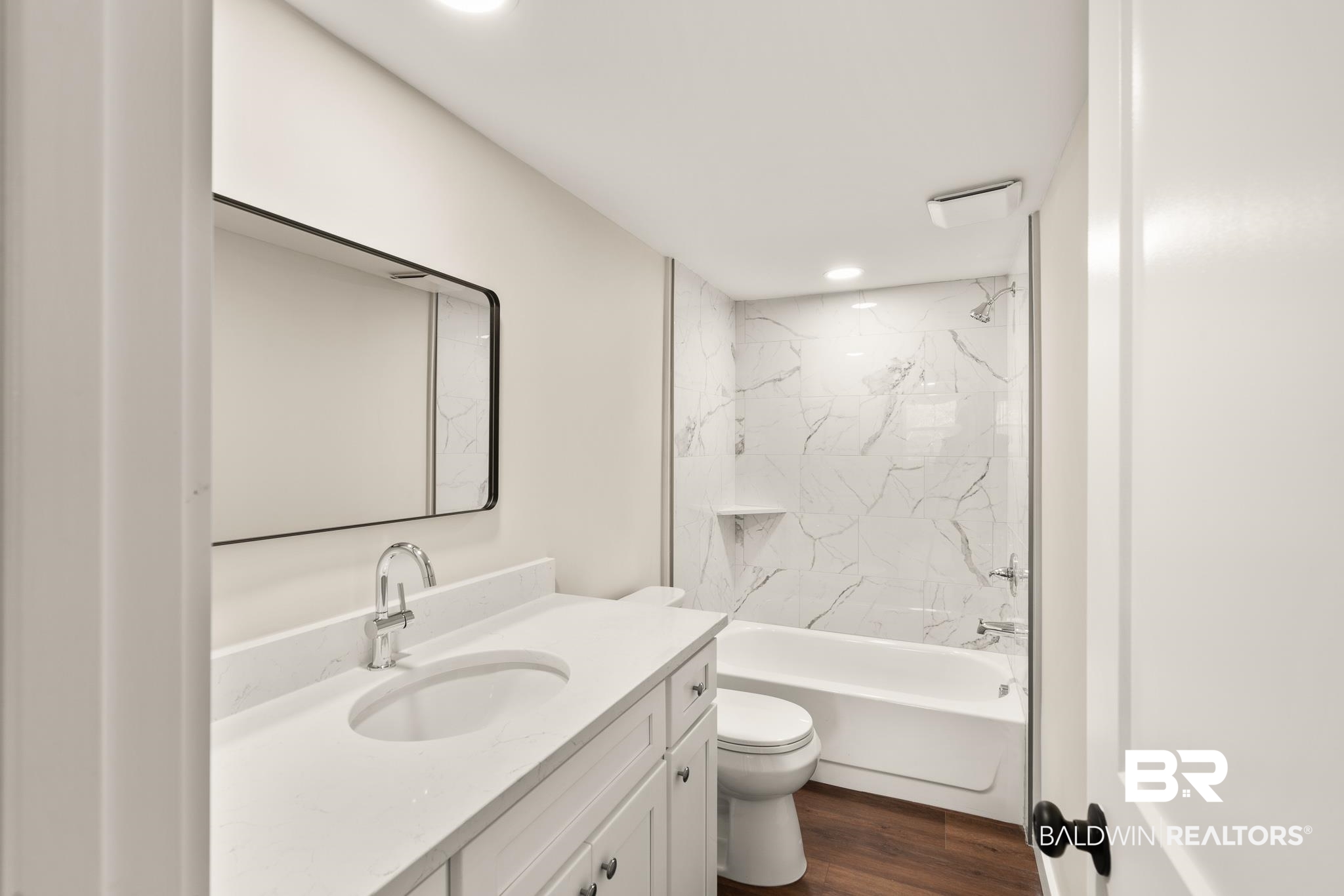 12645 Breman Road Elberta, AL 36530 - Photo 27 of 44 Bathroom featuring toilet, shower / bathtub combination, vanity, and wood finished floors