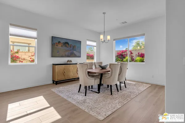 a kitchen with stainless steel appliances granite countertop a stove and cabinets