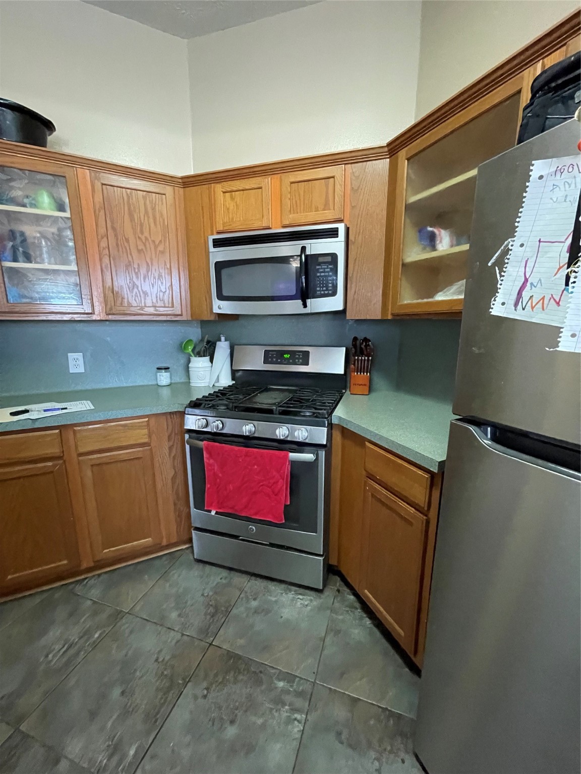 22911 Sebastian Drive Porter, TX 77365 - Photo 3 of 10 a kitchen with stainless steel appliances granite countertop a refrigerator and a stove