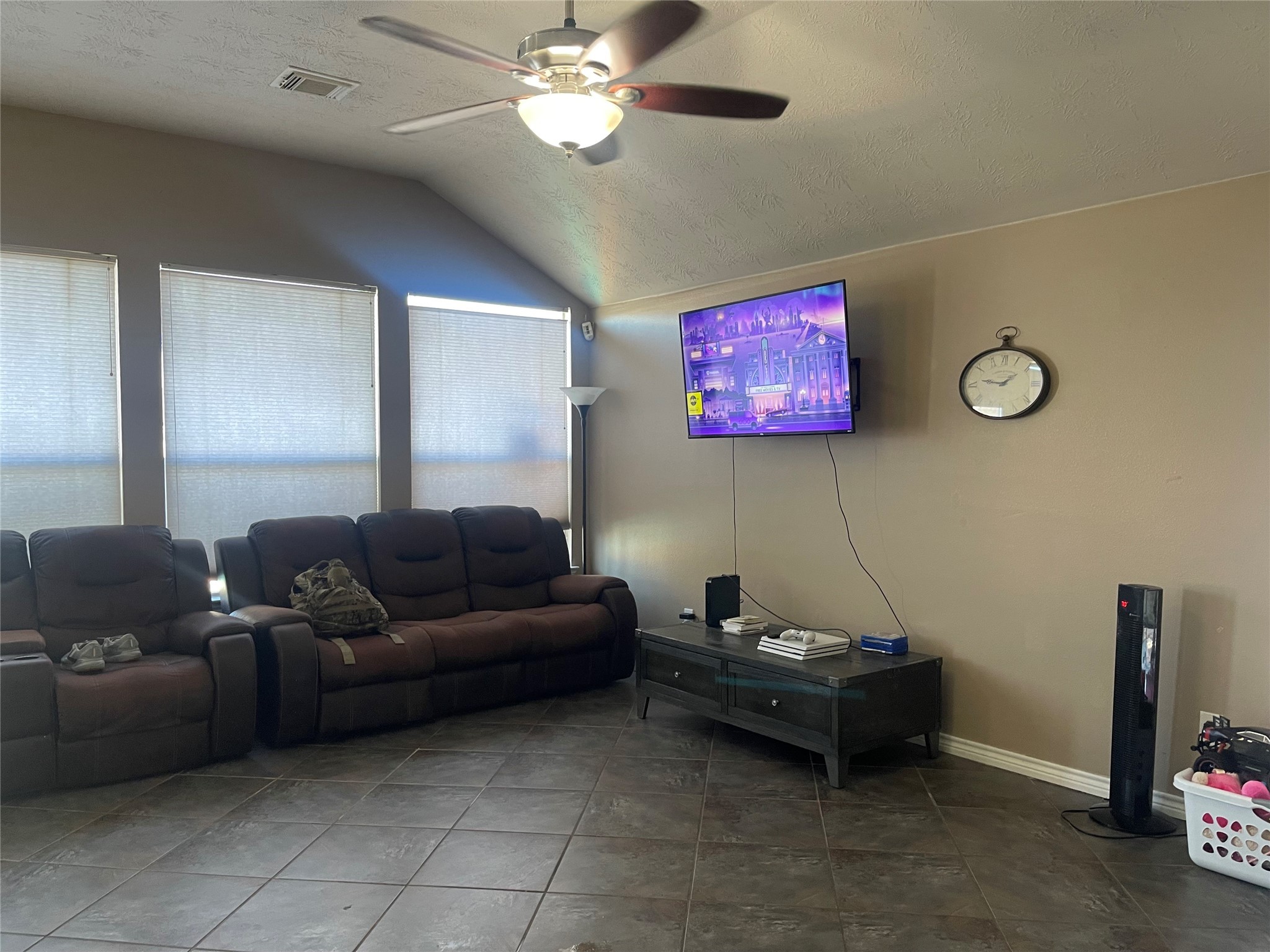 22911 Sebastian Drive Porter, TX 77365 - Photo 6 of 10 a living room with furniture and a flat screen tv